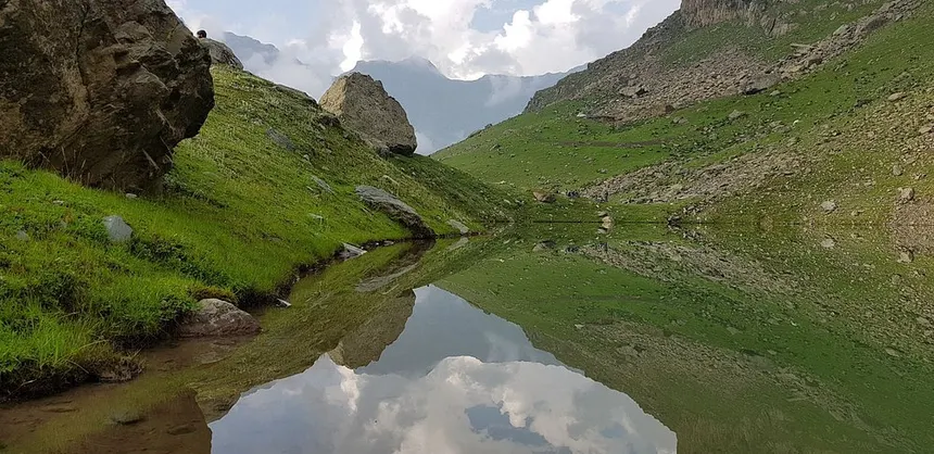 Alpine tarn mirror reflection