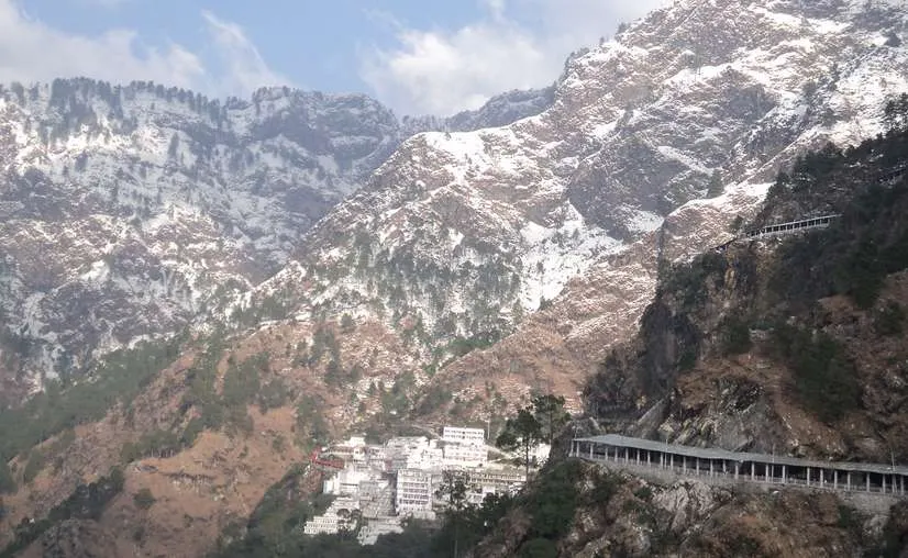 Covered Yatra track and Bhawan complex with snow-capped Trikuta peaks towering behind