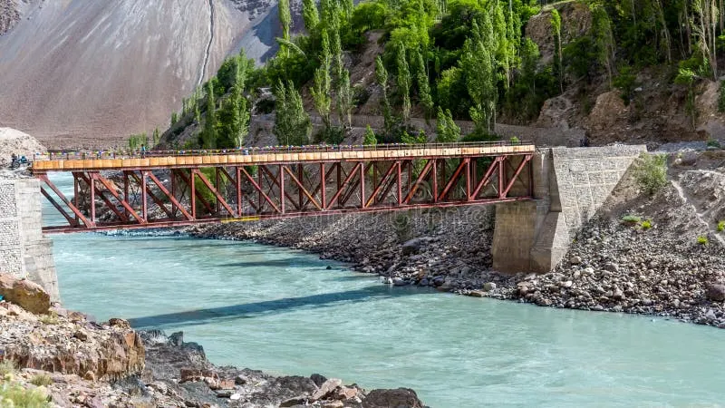 Iron truss bridge spanning the glacial blue Indus river in Batalik sector Kargil