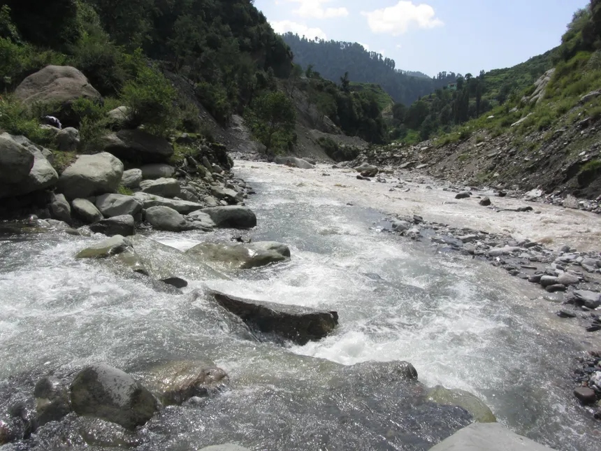 Mountain stream rapids and boulders